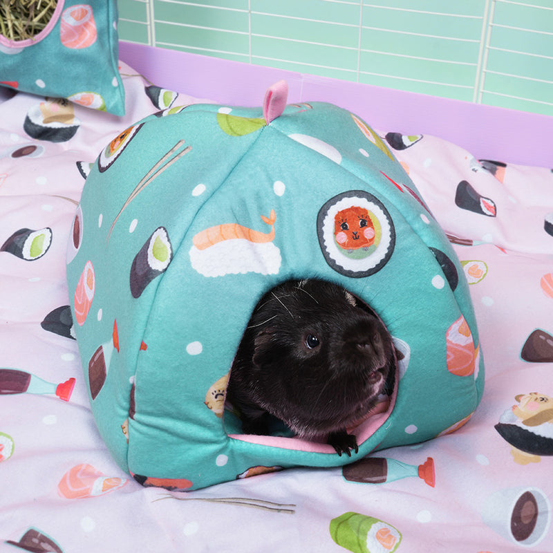 Black Guinea Pig in Kavee limited edition Sushi design hidey house on Sushi fleece liner in white cage