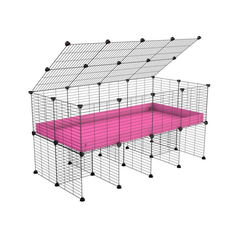 a 4x2 C&C cage for guinea pigs with a stand and a top pink plastic safe grids by kavee