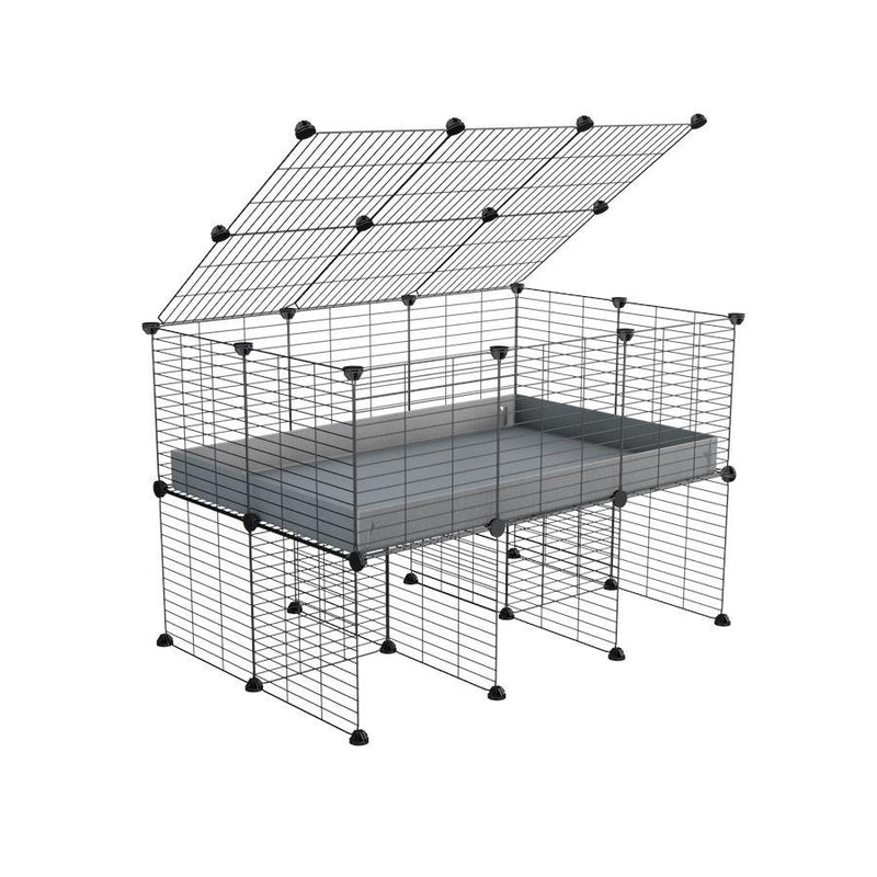 a 3x2 C&C cage for guinea pigs with a stand and a top grey plastic safe grids by kavee