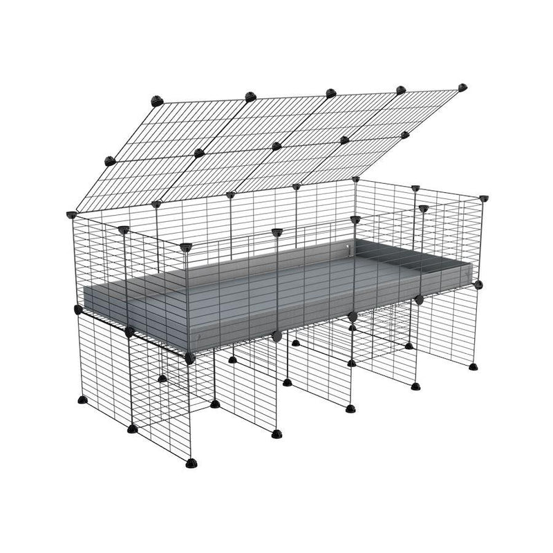 a 4x2 C&C cage for guinea pigs with a stand and a top grey plastic safe grids by kavee