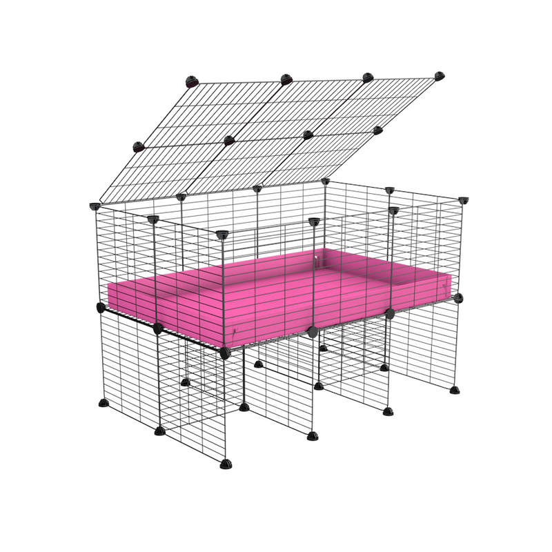 a 3x2 C&C cage for guinea pigs with a stand and a top pink plastic safe grids by kavee