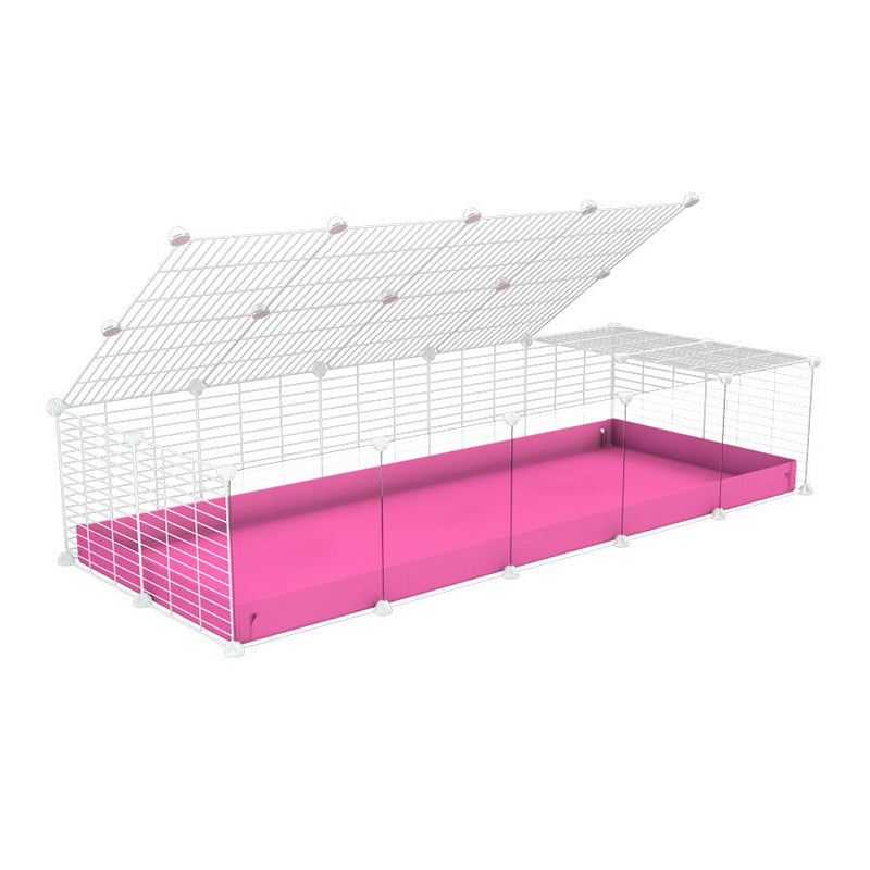 A 2x5 C and C cage with clear transparent plexiglass acrylic grids  for guinea pigs with pink coroplast a lid and small hole white C&C grids from brand kavee